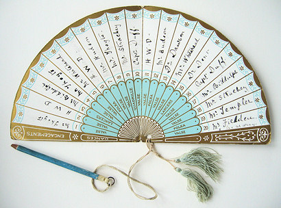 Regency dance card in form of an open fan with names written on each panel and a pencil attached by cord